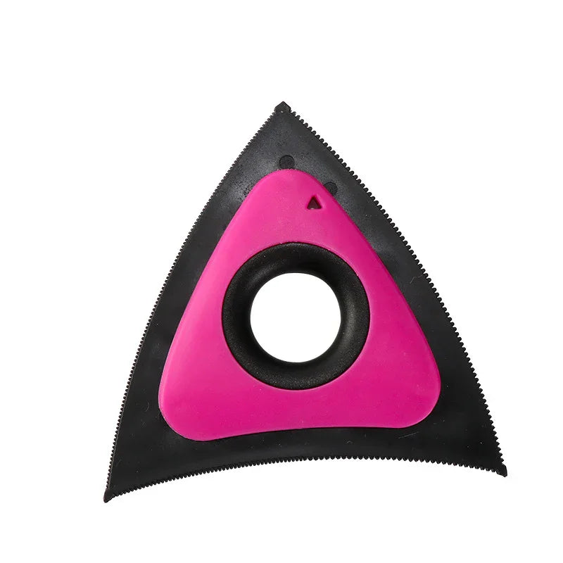 Pink and black triangular pet hair remover tool with textured edges for furniture and upholstery