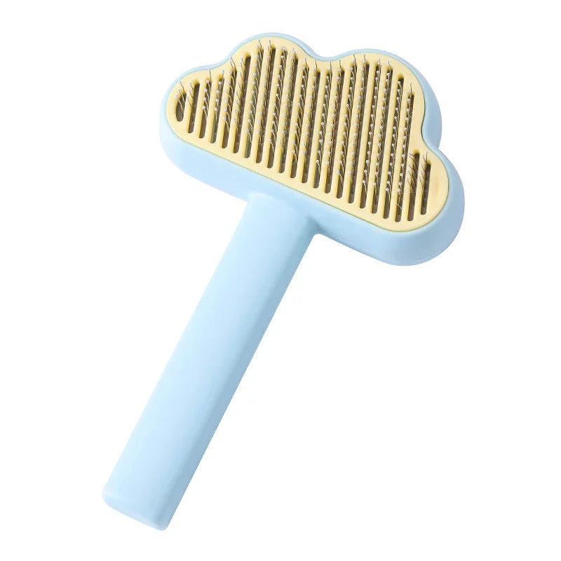 Cloud-shaped pet grooming brush with soft blue handle and gold bristles for gentle fur removal